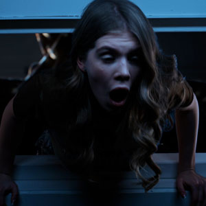 But a huge monster grabs her