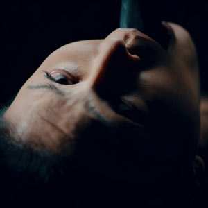 Rae Lil Black gags on a tentacle