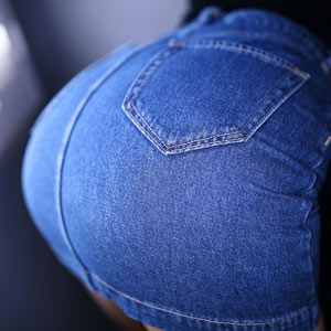 Ass in denim skirt