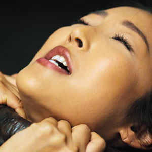 Emiri's neck is grabbed by a tentacle