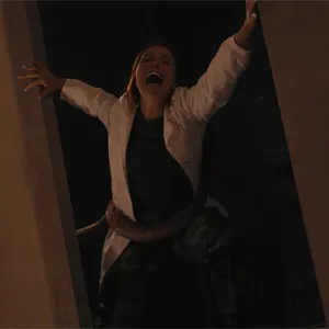 The creature grabs Clemence