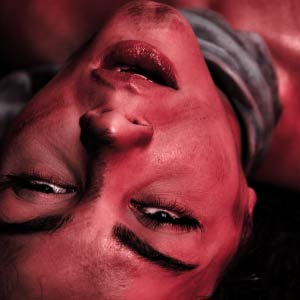 Grabbing her neck too