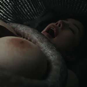 A huge tentacle holds her down