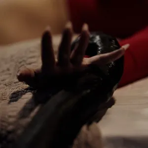 Her hands are tied down