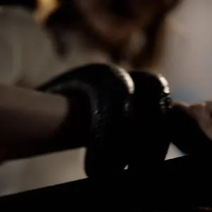 Her hands are tied down