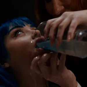 Jewelz Blu drinking the liquid