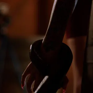 Grabbing her hands