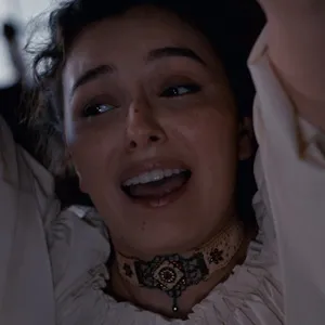 Leana chained to the ceiling