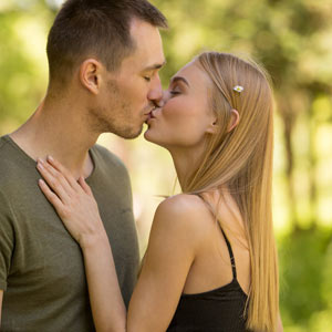 Couple kissing in the park