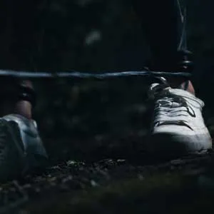 Her legs are tied by vines