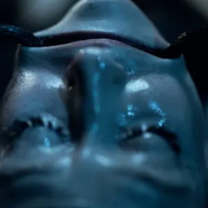 Stretching her mouth