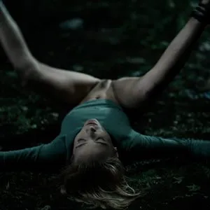 Kelly Collins tied down by vines