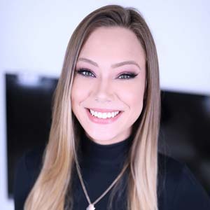 Avery Cristy smiling for the camera