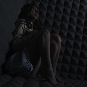 In a dark padded cell