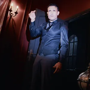 Emmanuel enters the room