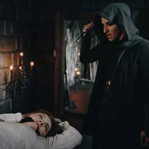 Sata Jones tied to the table