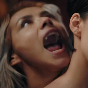 By biting her on the neck