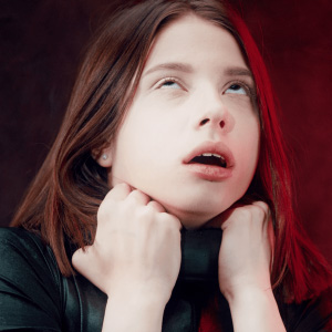 Tentacle crawling around her neck